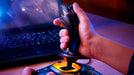 Hand on the T.16000M FCS stick at a desk