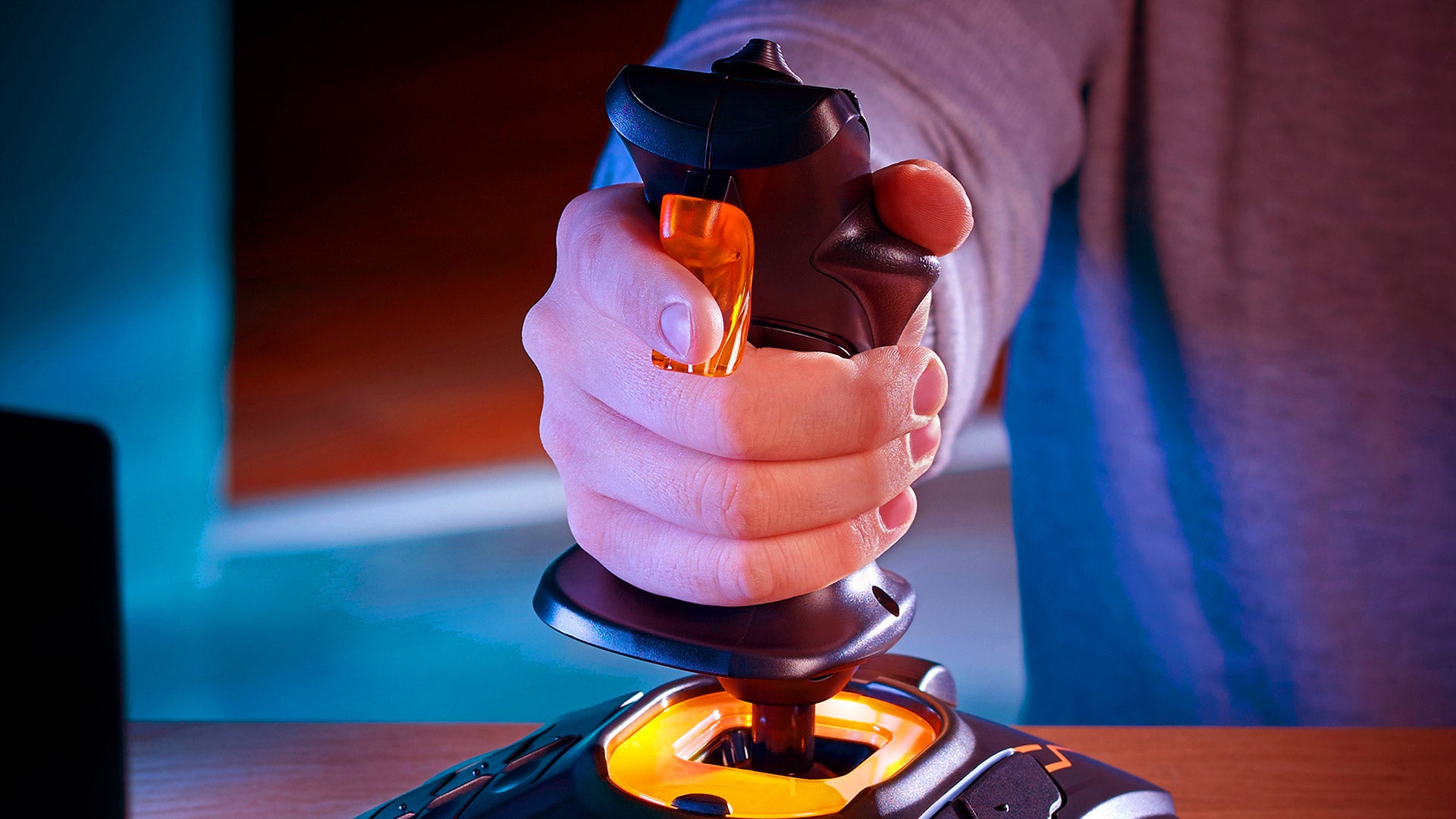 Close-up of a hand gripping the T.16000M FCS stick