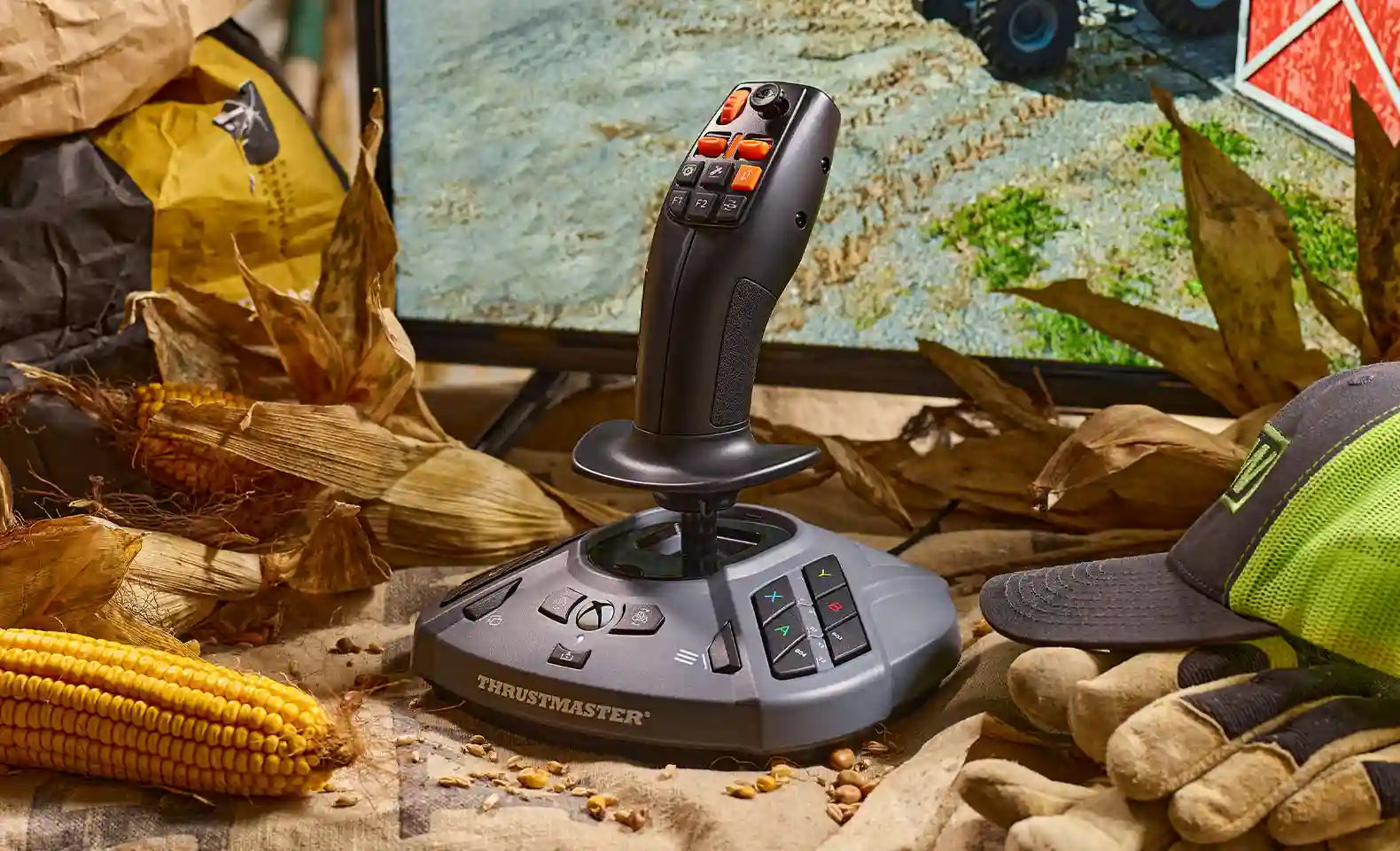 SimTask FarmStick on a desk with corn