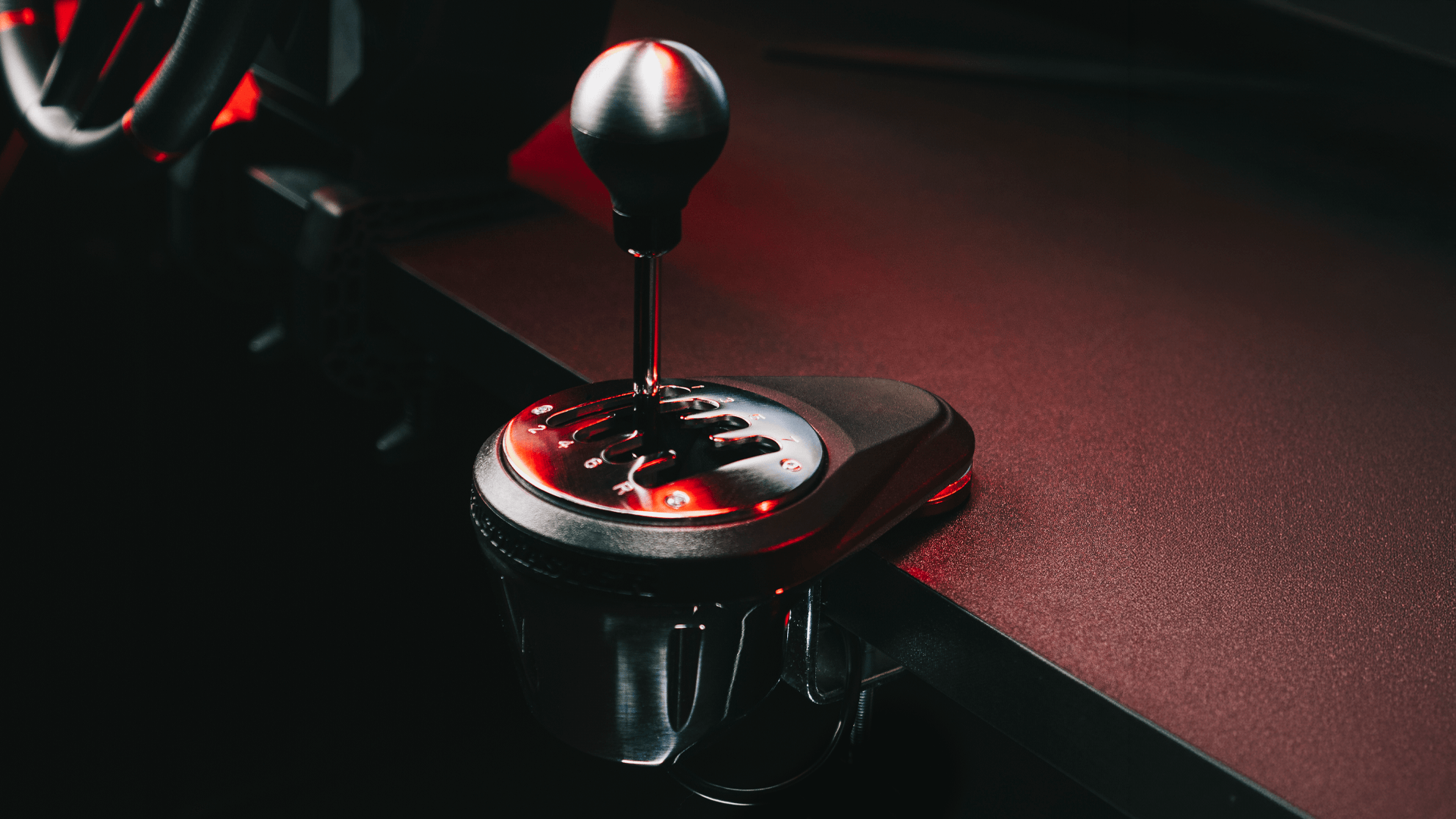 TH8A shifter mounted beside a racing wheel