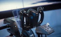 TCA Yoke Boeing Edition on a desk with a throttle quadrant