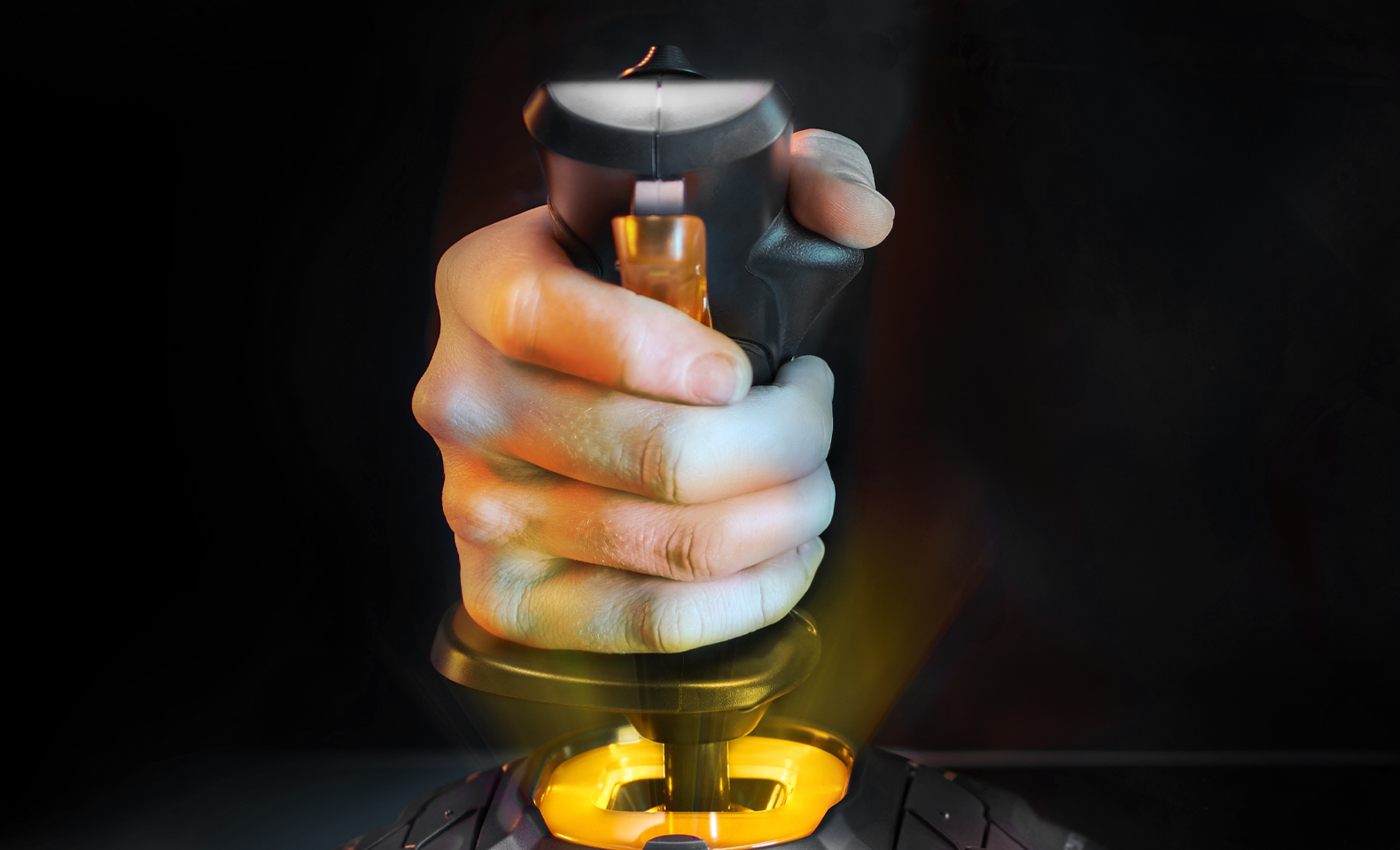 T.16000M FCS stick gripped in hand with backlit base
